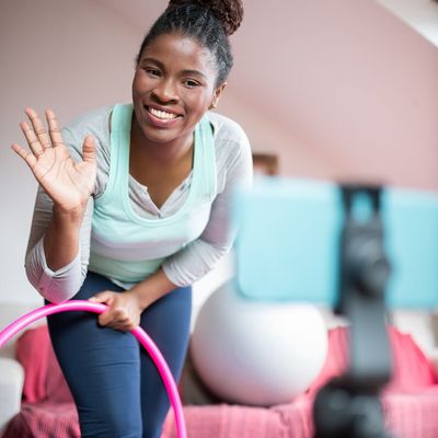 Professional wellness instructor Margarita Didenko smiling warmly at camera.
